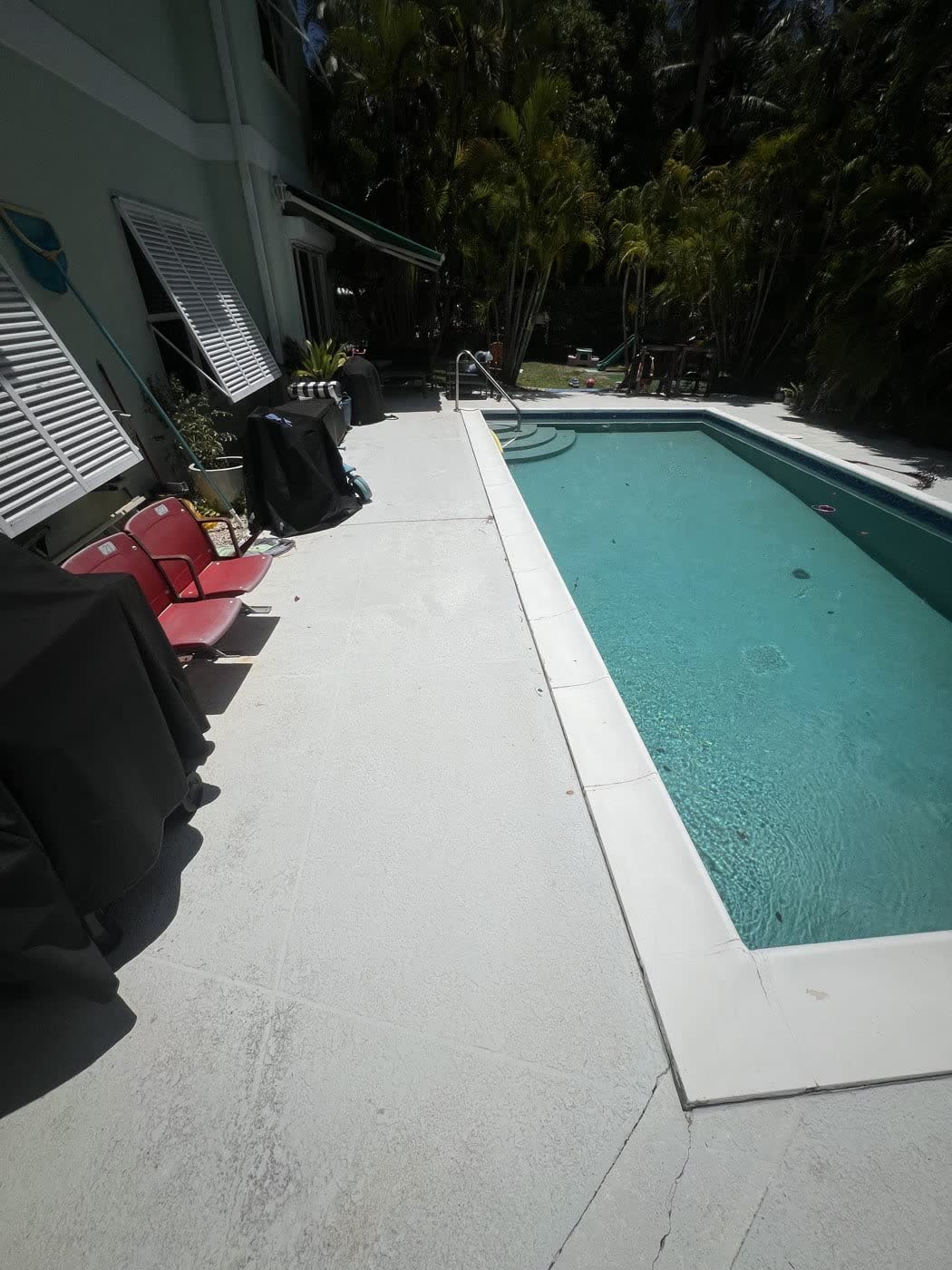 Pool deck restored — Concrete & coping, by Cayman Clean & Blast, Grand Cayman